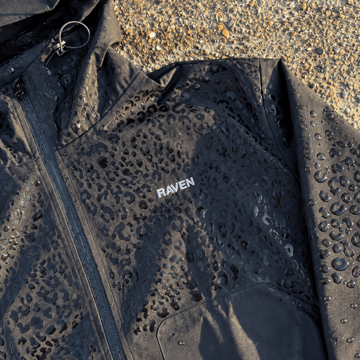 Water Reactive Cheetah Rain Jacket - Black